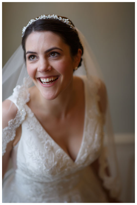 Happy bridal portrait beautiful window light in the stairwell at the Inn on Boltwood