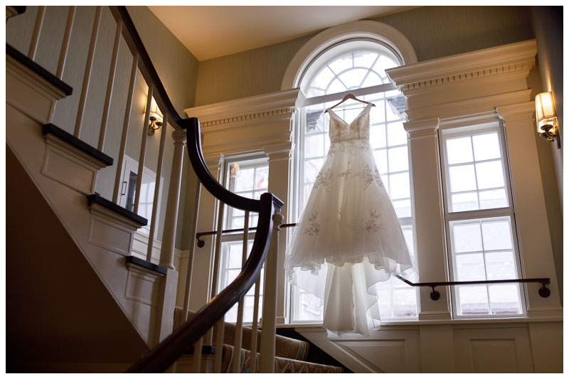 Gorgeous wedding dress hanging in the window of the Inn at Boltwood.