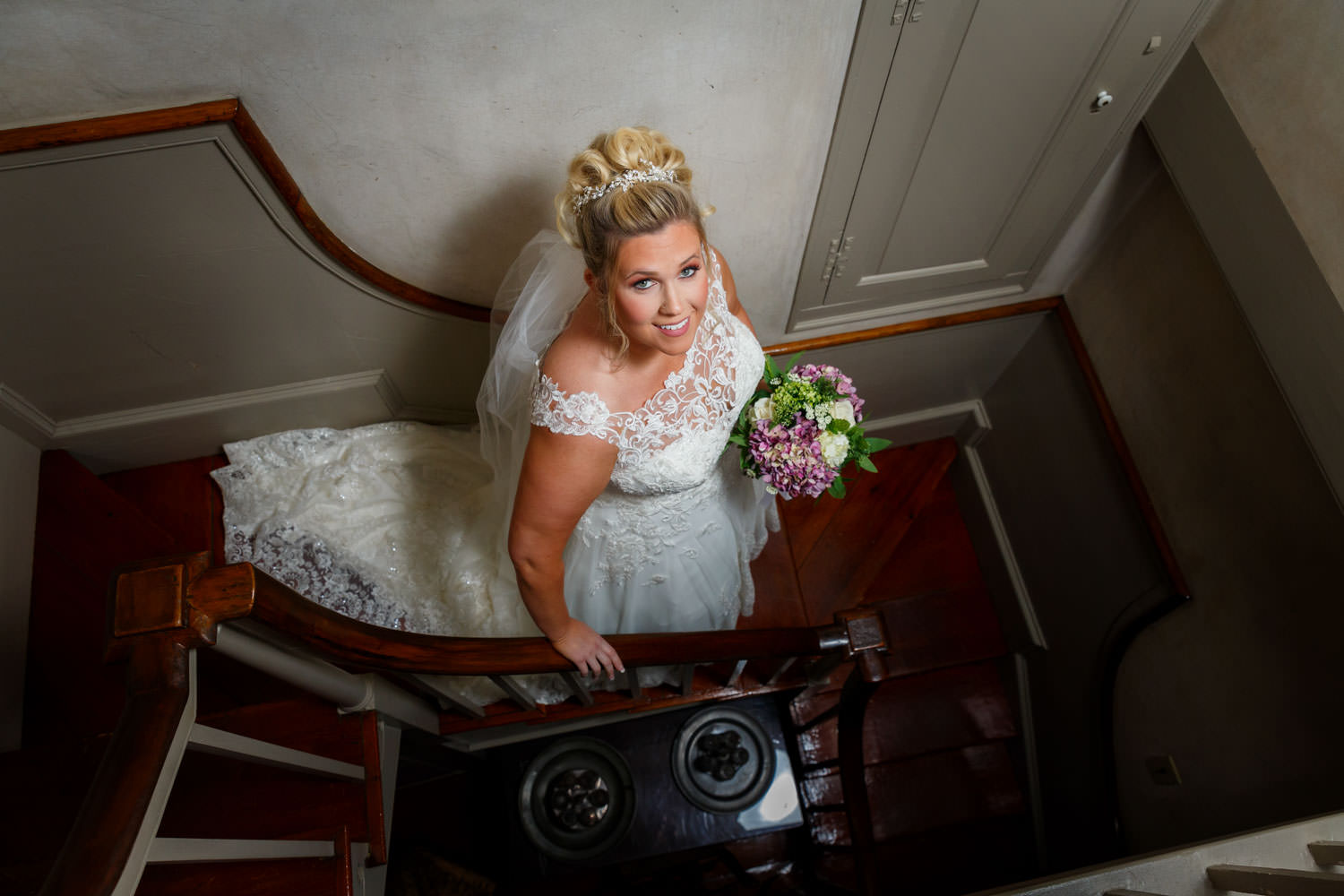 Bride walking down stairs on her way to the ceremony