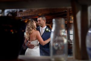 bride and groom first dance in barn