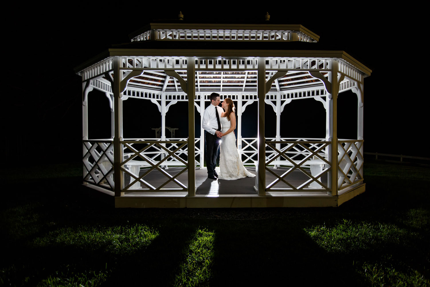 Bride and Groom portrait at night inside gazebo
