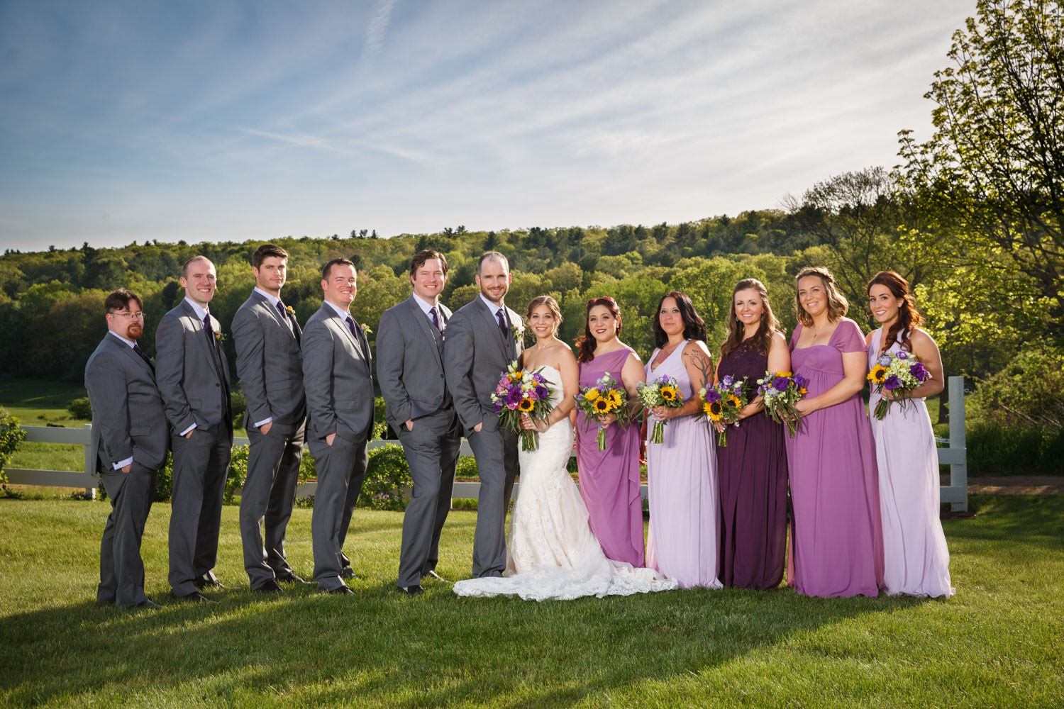 Wedding party photo, outside with rolling hills in the background