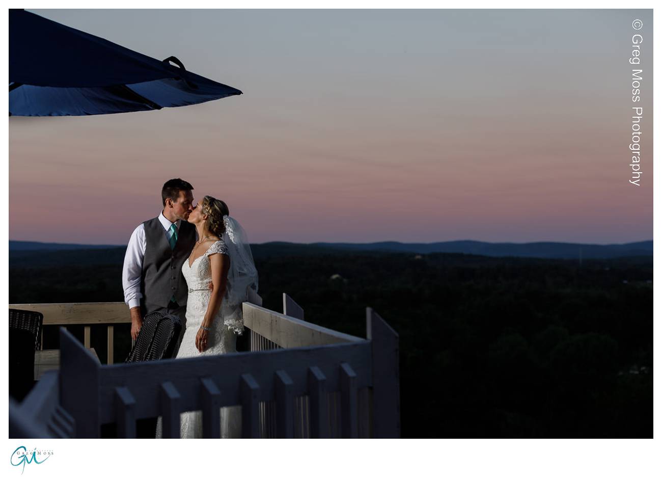 Bride and Groom on Mountain Rose Inn Deck at sunset