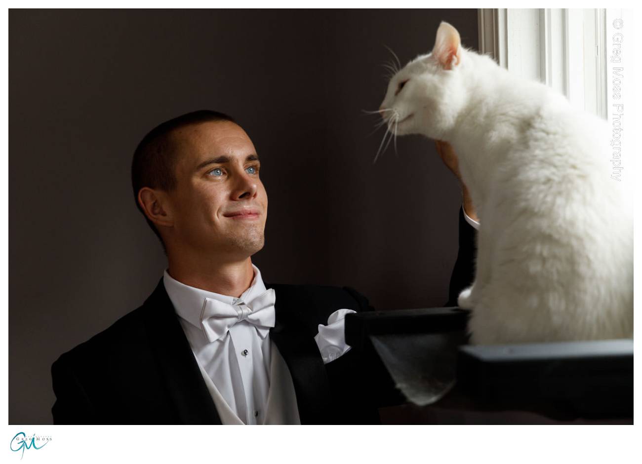 Groom with his white cat