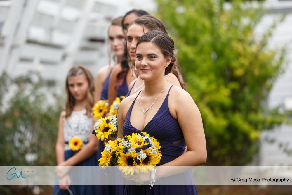 maid of honor holding flowers during ceremony