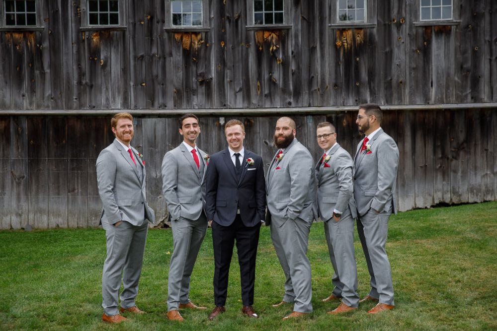 Groom and Groomsmen with rustic barn in background