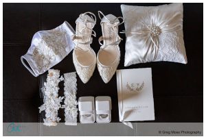 Bride's details including shoes, garter, rings,