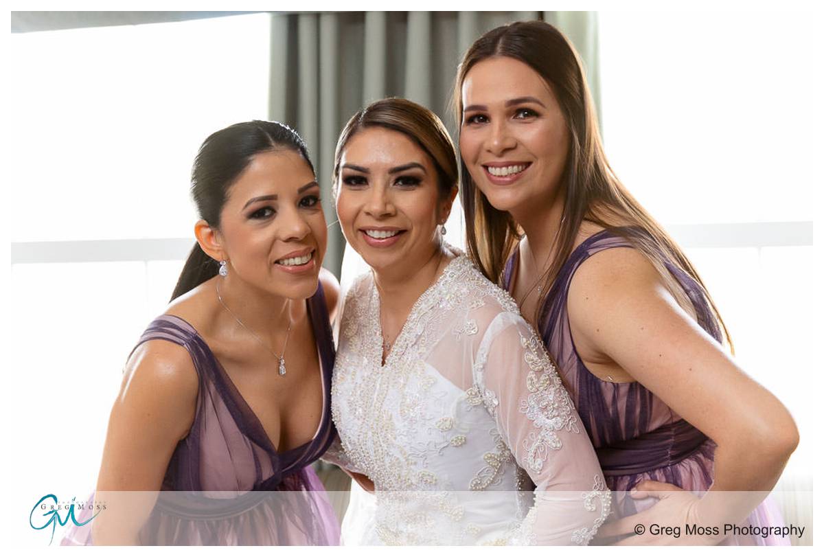 Bride and Bridesmaids on wedding day getting ready