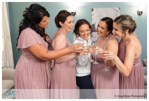 Bridesmaids toasting with champagne