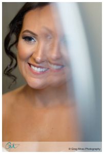 Portrait of bride in front of mirror
