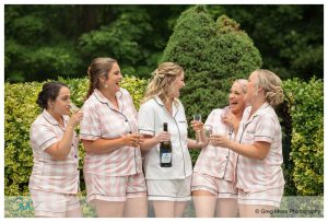 Bridal party toasting with champagne by the pool