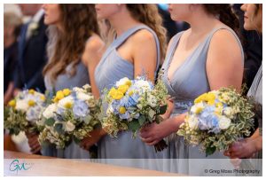Bridesmaids with bouquets at our Lady of Valley Parish in EastHampton Ma.