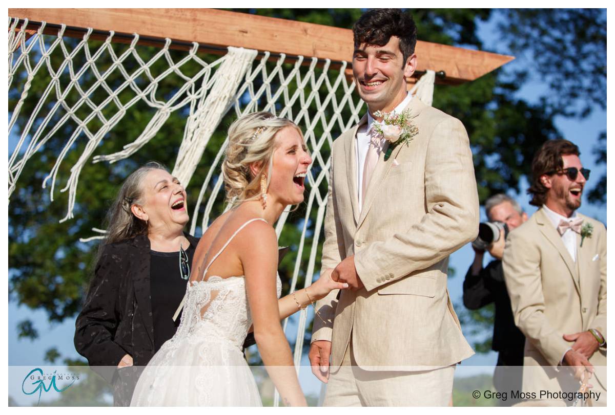 Bride and Groom laughing during ceremony