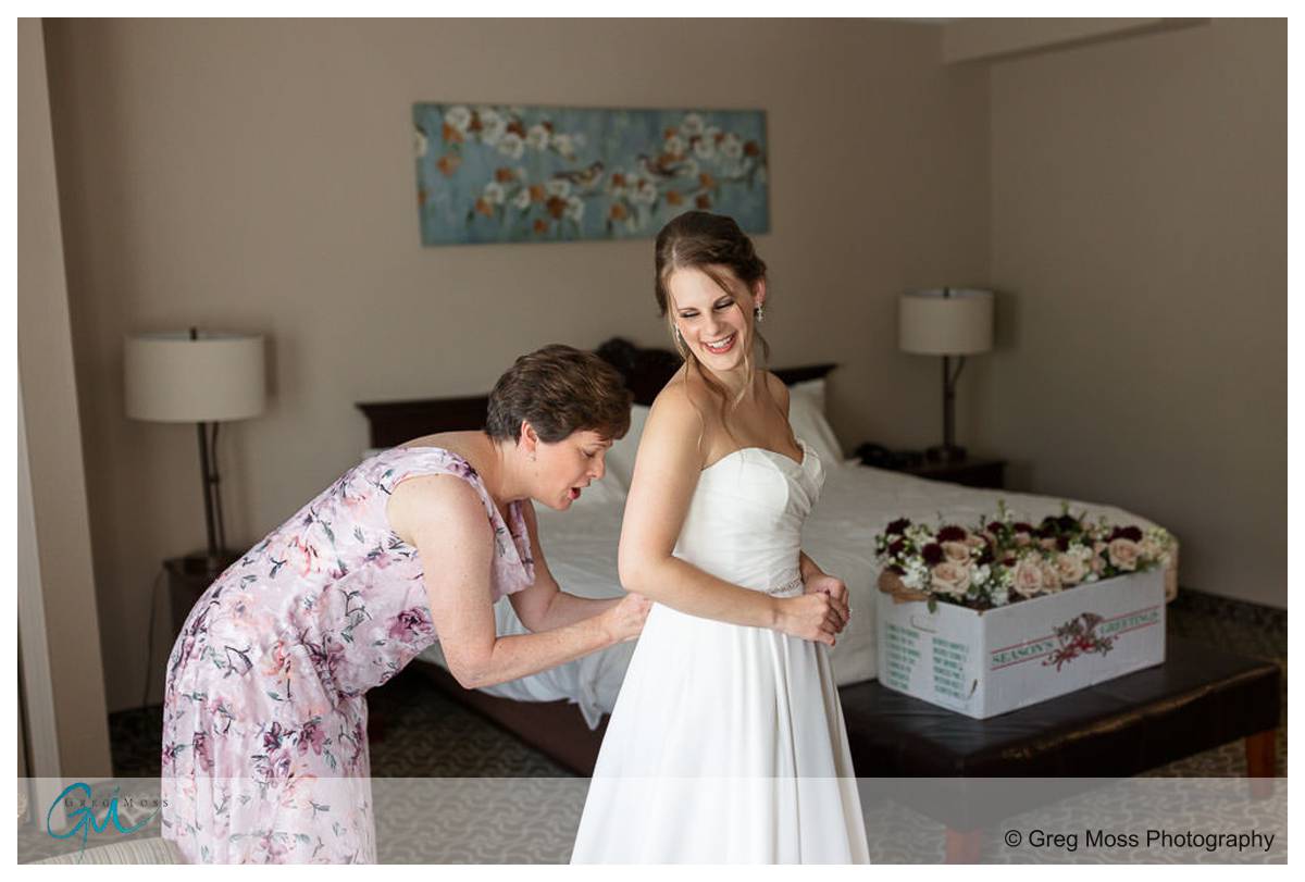 Mom Helping bride with wedding dress