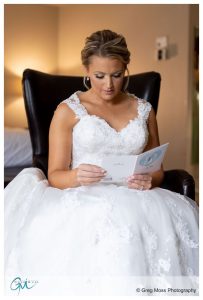 Bride reading letter day of Wedding from Groom