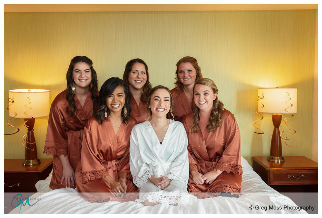 Bridal party on bed