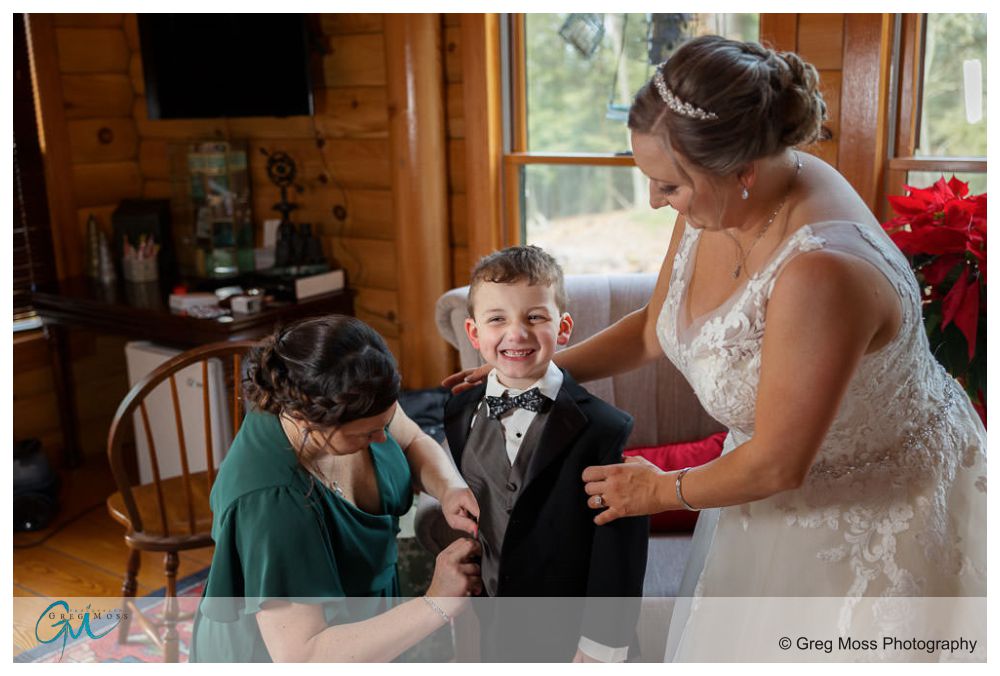 Bride, son and Matron of honor getting dressed