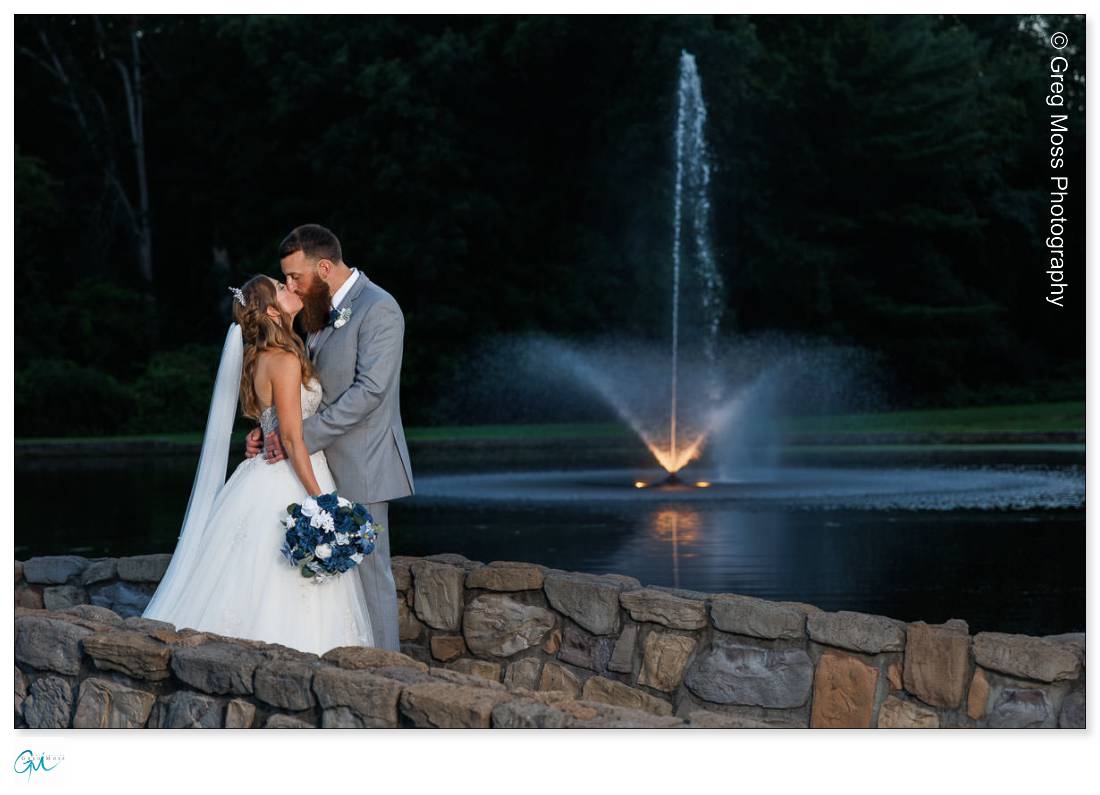 Wedding Couple in front of fountain at the Aqua Turf Club