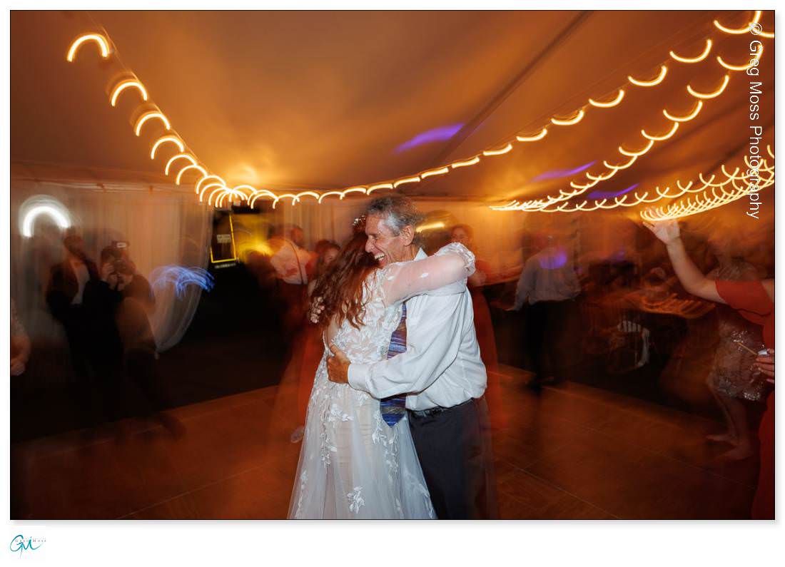 Bride and father hugging on the dance floor