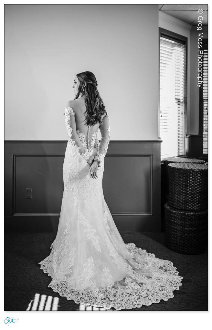 Black and White photo of the bride and the back of her dress