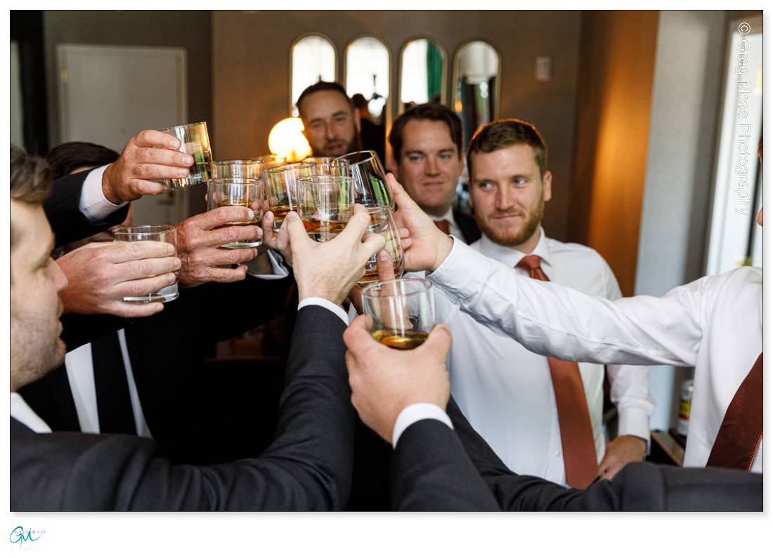 Groom and groomsmen toasting with Whiskey